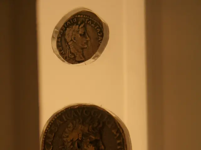 In this image there are three coins, there is a man and text on the coins, at the background of the...