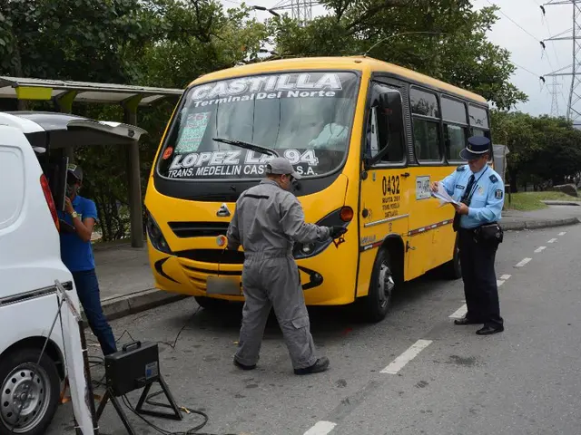 In this picture there is a security person who is holding the papers. In front of him there is...