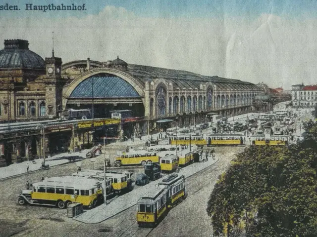 The image shows an old postcard of a train station in Dresden, Germany. It features a bustling...
