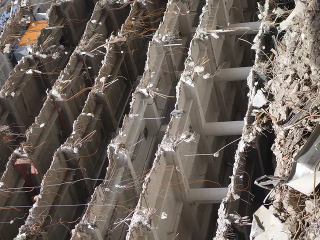 The image shows a building that has been partially demolished, with the sky visible at the top. The...