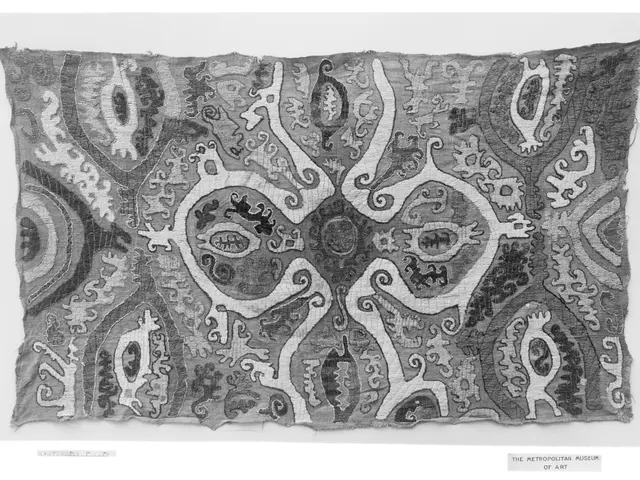 The image shows a black and white textile with a pattern on it. The pattern is intricate and...