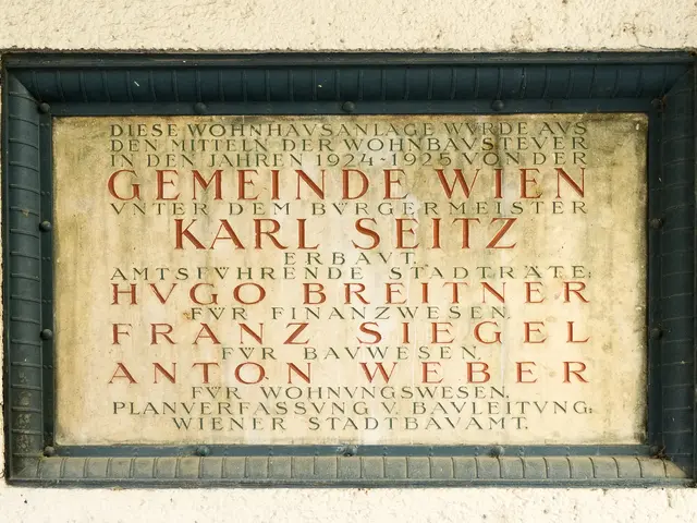 The image shows a plaque on the side of a building that reads "Geminde Wien Karl Seitz". The plaque...