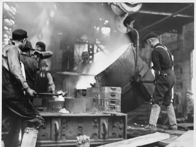 The image shows a group of men working on a piece of metal in a black and white factory. They are...