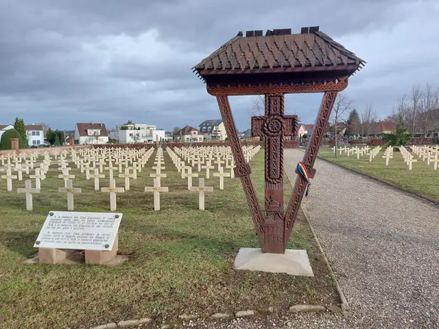 The image shows a cemetery with a gazebo in the middle of it, surrounded by grass and a board with...