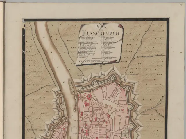 The image shows an old book with a map of the city of Frankfurt, Germany. The map is detailed and...