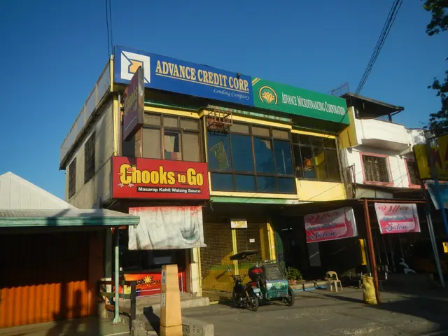 The image shows a building with a sign that reads "Advance Credit Corp" on the side of it,...