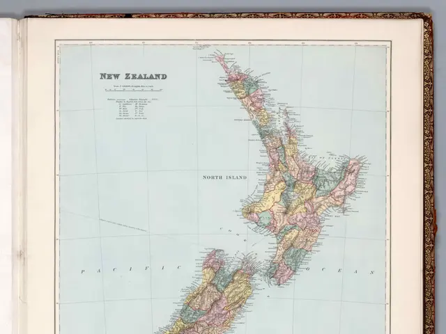 The image shows an open book with a map of New Zealand on it. The map is detailed and shows the...