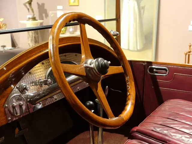 The image shows the interior of a car with a wooden steering wheel, leather seats, a door with a...