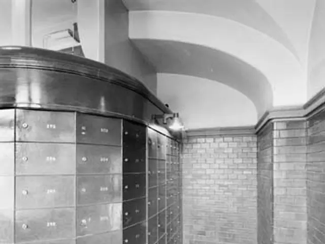 The image shows a black and white photo of a room with a wall of lockers, a floor, a pillar, and a...