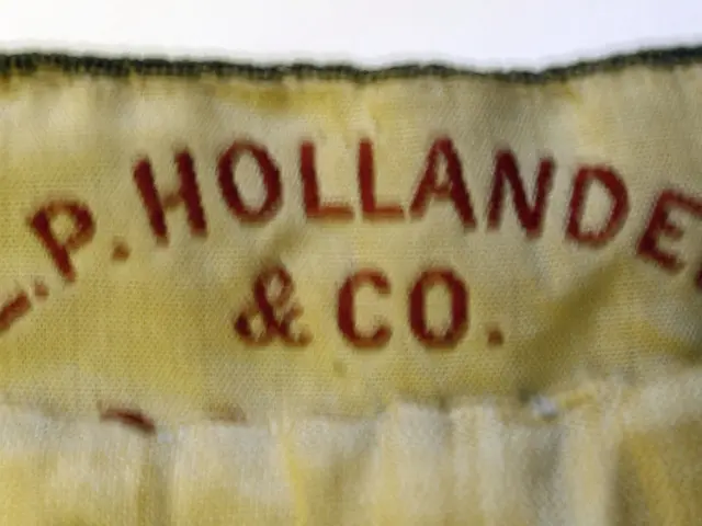 The image shows a close up of a label on a piece of fabric with the text "L.P. Hollander & Co"...