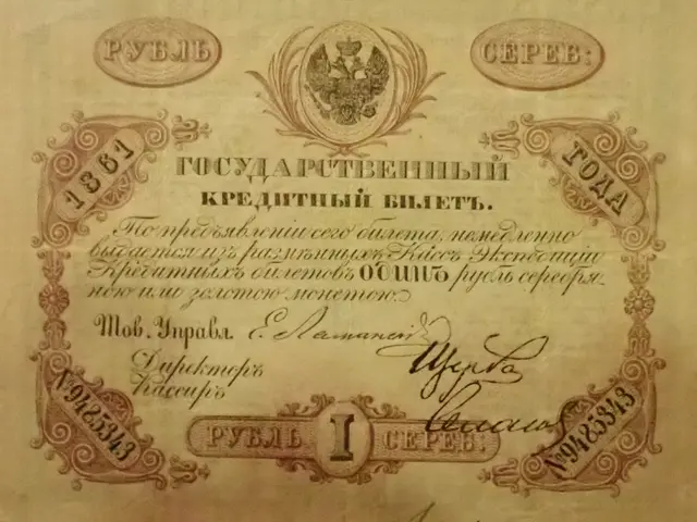 The image shows an old Russian banknote with a red background and a picture of a man on it. The...