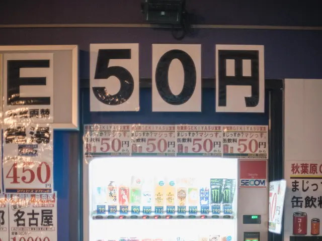 The image shows a vending machine sitting on the side of a street at night. The machine is...