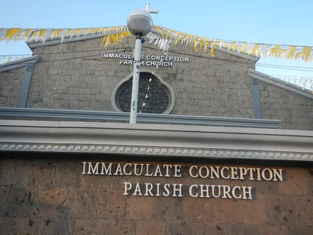 The image shows the immaculate conception parish church, a building with text on the wall, a light...