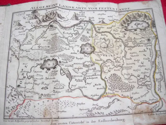 The image shows an old book with a map of Germany on it, placed on a red surface. The map is...