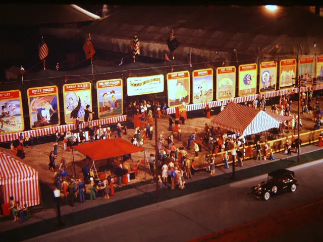 The image shows an old photo of a carnival at night, with a group of people standing on the ground,...