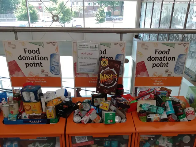 The image shows a food donation point in a building with orange cabinets filled with food items...