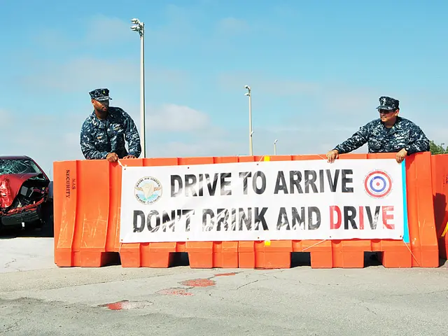 The image shows two police officers standing next to a car that has been involved in a crash. The...