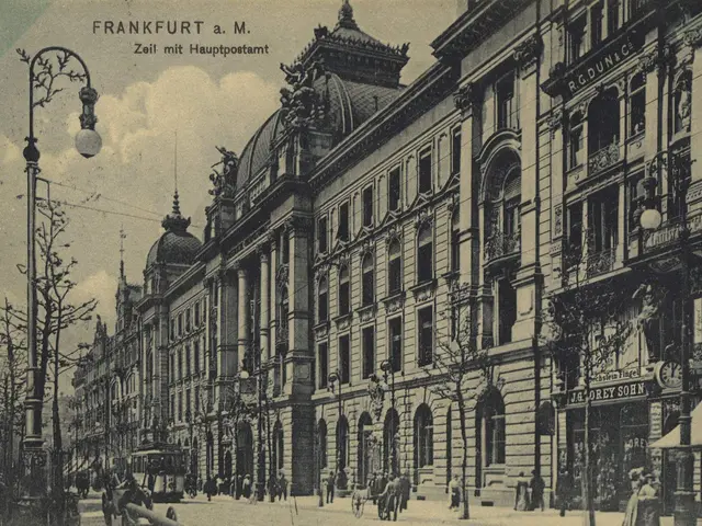 The image shows an old black and white photo of a city street in Frankfurt, Germany. We can see a...