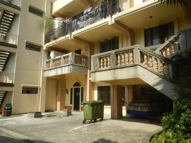 The image shows an apartment building with balconies, railings, doors, windows, stairs, dustbins,...
