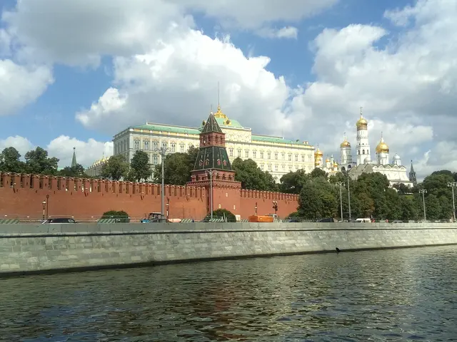 The image shows a view of the Moscow Kremlin from the Red Square, with a body of water in the...