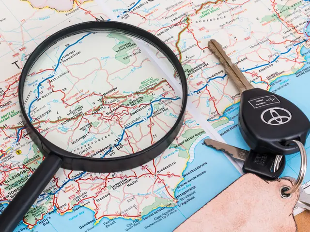 The image shows a magnifying glass hovering over a map with a car key resting on top of it,...