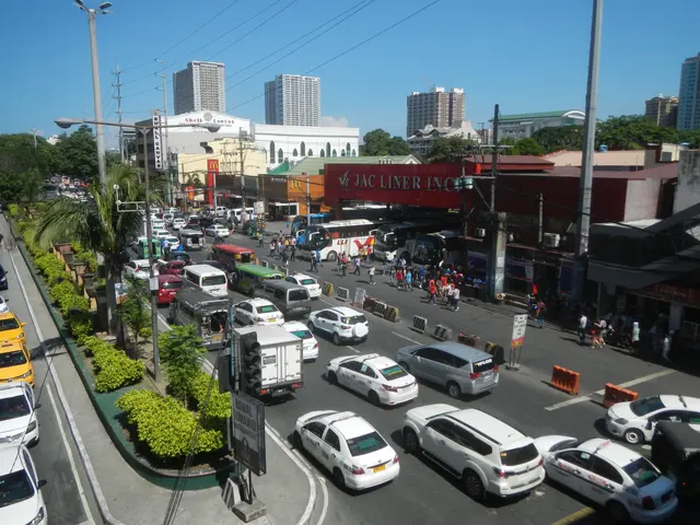 The image shows a bustling city street filled with lots of traffic, including cars, buses, and...