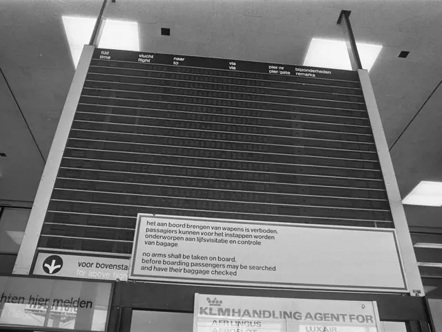 The image shows a black and white photo of an airport departure board, with a few boards attached...