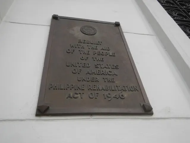 The image shows a plaque on the side of a building that reads "Philippine Rehabilitation Act of...