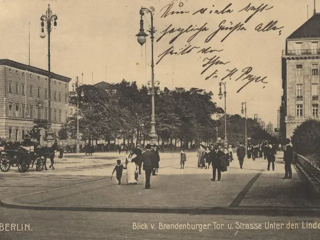 The image shows an old black and white photo of people walking down a street in Berlin, Germany....
