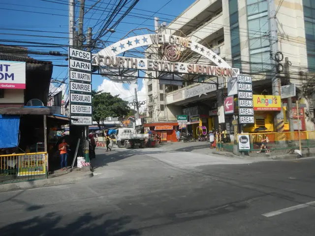 The image shows a bustling city street with vehicles driving on the road, people walking on the...
