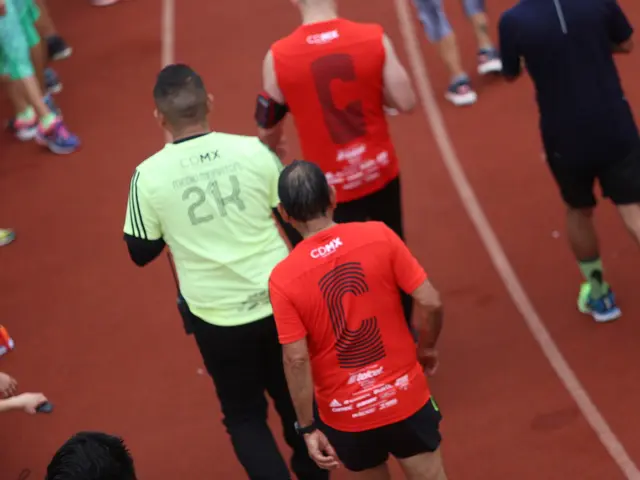 The image shows a group of people running on a track, with some of them wearing sneakers and hats.