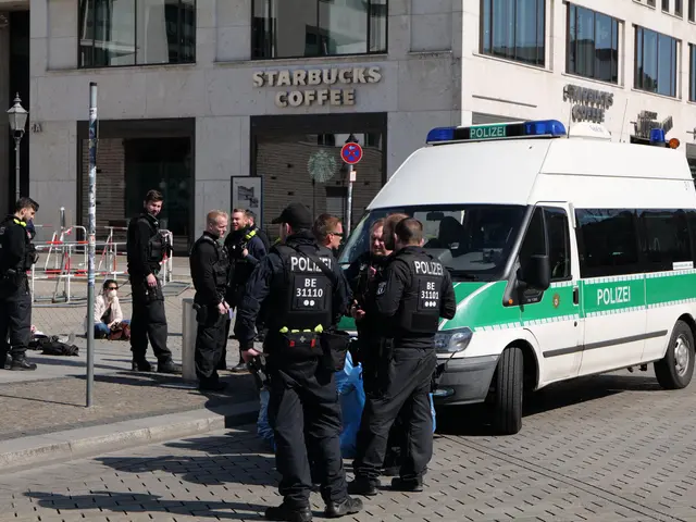 The image shows a group of police officers standing in front of a Starbucks coffee shop. There is a...