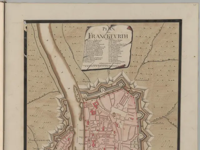 The image shows an old book with a map of the city of Frankfurt, Germany. The map is detailed and...