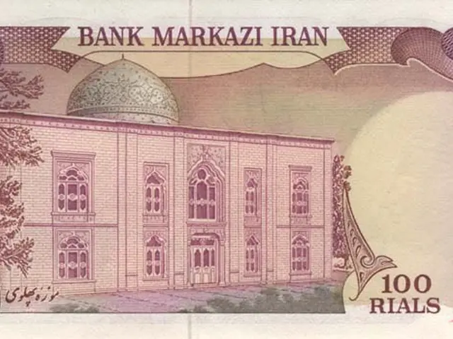 The image shows an Iranian 100 rials banknote with a picture of a building on it. The banknote is...