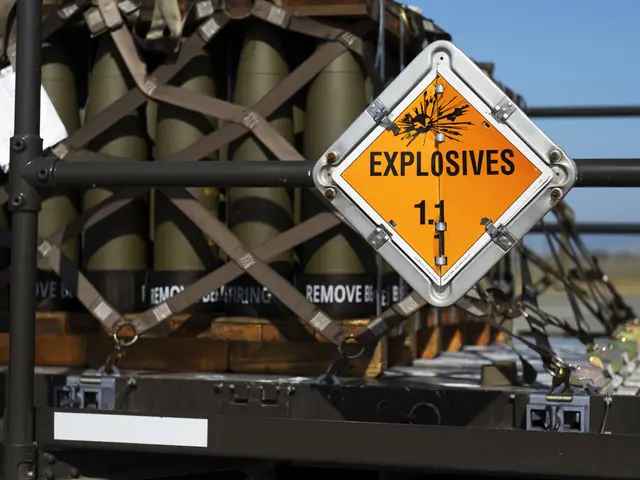 The image shows a truck with a sign that reads "Explosives 1.1" on the back of it, surrounded by...