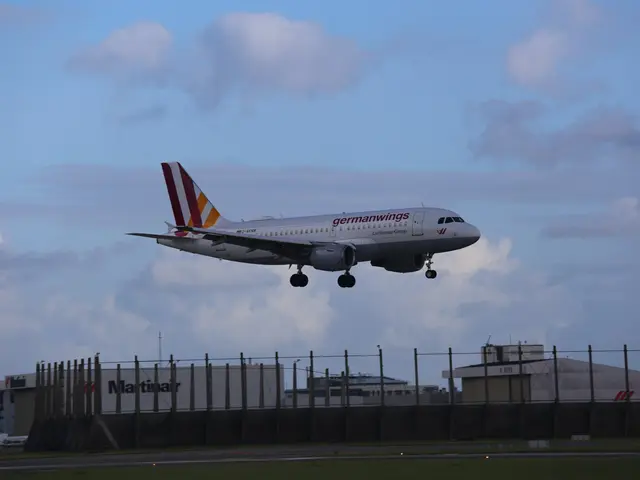 The image shows a Germanwings Airbus A320-200 taking off from Frankfurt Airport, with grass on the...
