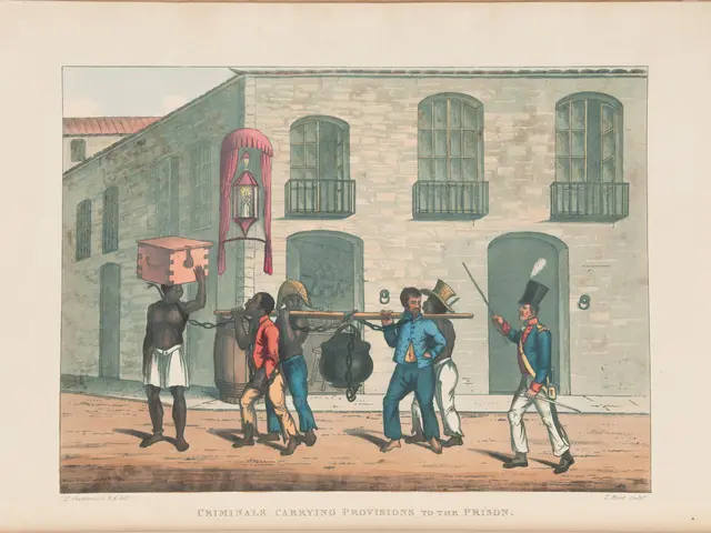 The image shows a group of men standing in front of a building, with one of them holding a box on...