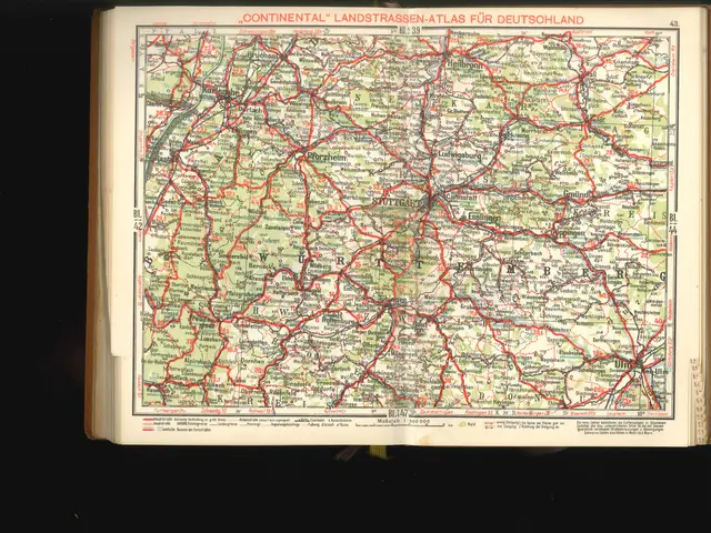 The image shows an open book with a map of Germany on it, set against a dark background. The map is...
