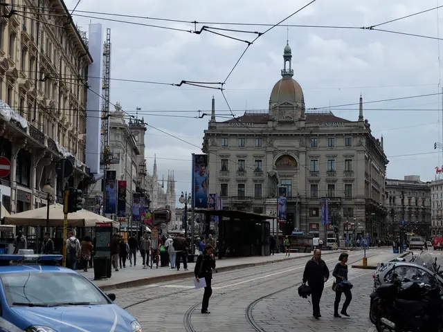 The image shows a bustling city street with a police car parked on the side of it. There are many...