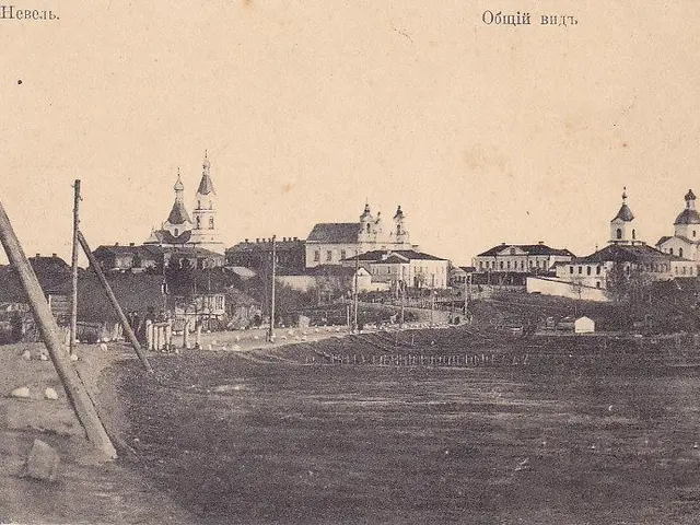 The image shows an old black and white photo of a city with a river running through it. On the left...