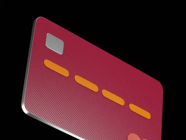 The image shows a red credit card with orange dots on it against a white background.