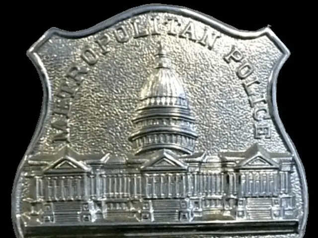 The image shows a silver police badge with the words "Investigator" written on it against a white...