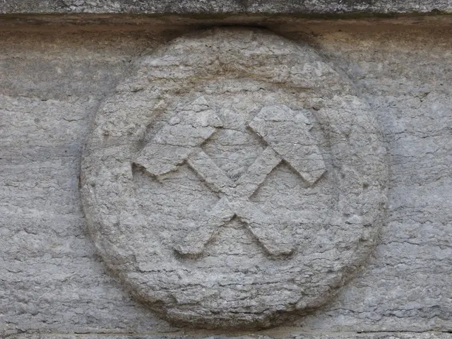 The image shows a stone carving on the side of a building depicting a swastika. The swastika is a...