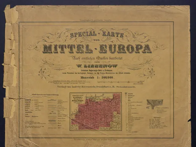 The image shows an old book with a map of the Mittel-Europa region on it, set against a dark...