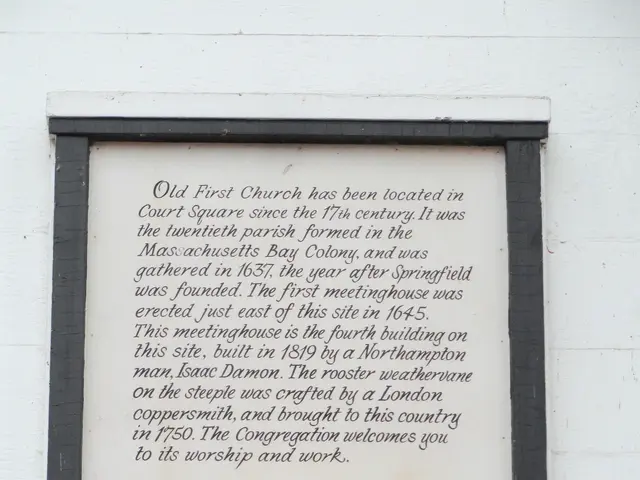 The image shows a plaque on the side of a building that reads "National Register of Historic...