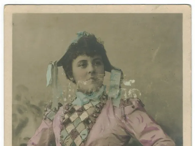 The image shows an old photo of a woman in a pink shirt and skirt, with a human face visible. At...