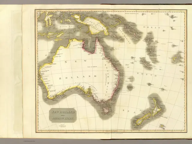 The image shows an open book with a map of Australia and New Zealand on it. The map is detailed and...
