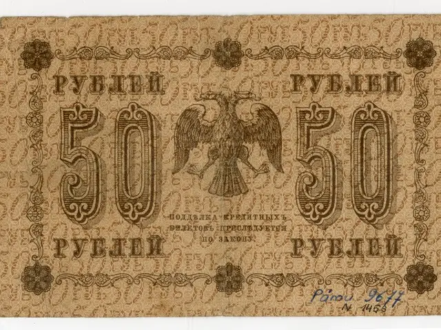 The image shows an old Russian banknote with a picture of an eagle on it against a white...