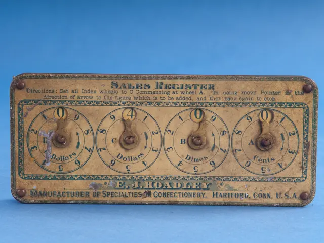 The image shows an old-fashioned sales register on a blue background. The board has text and...