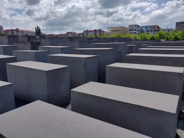 The image shows the Holocaust Memorial to the Murdered Jews of Europe in Berlin, Germany. It...